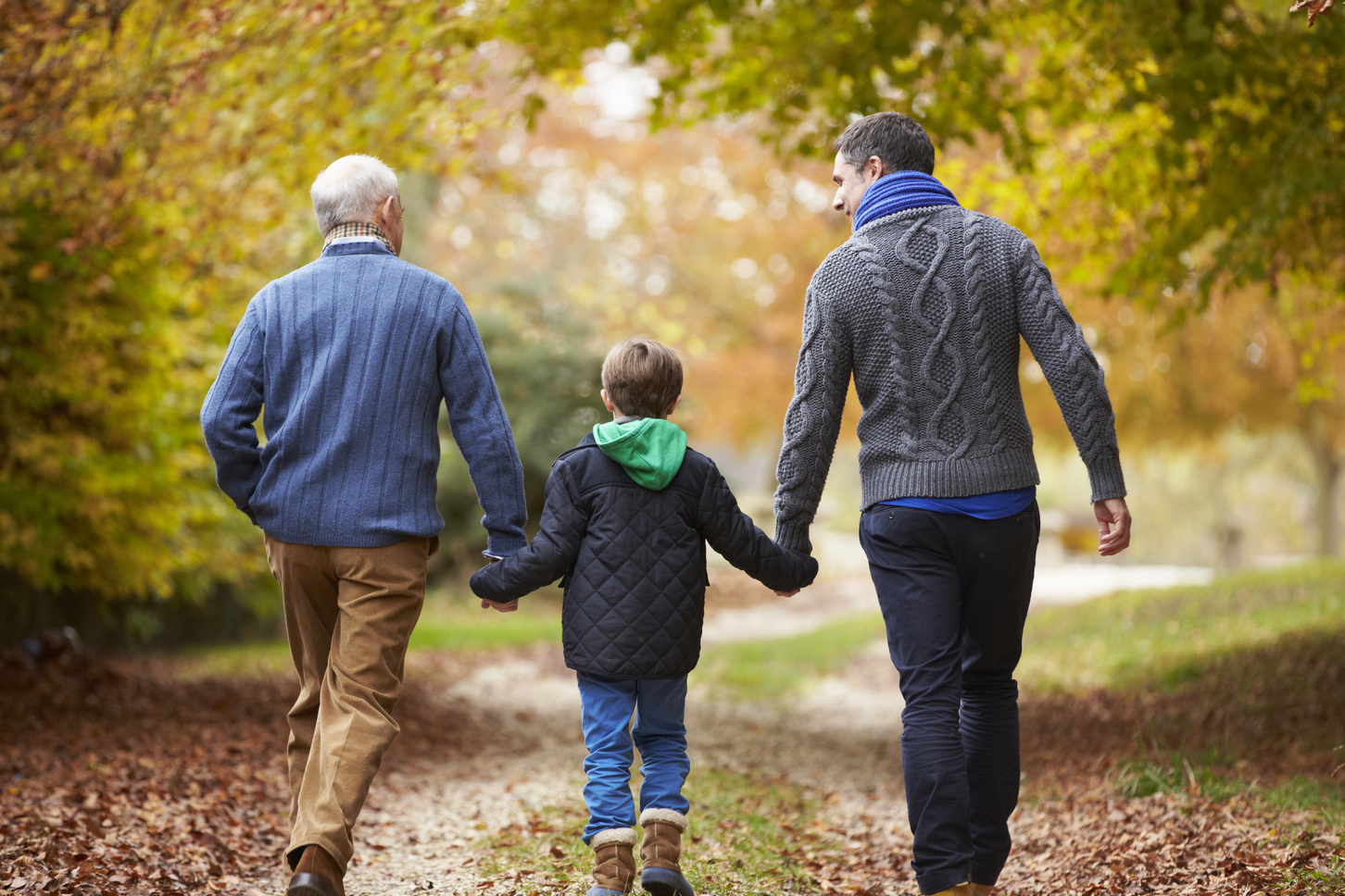 Multigenerational family walking on a path